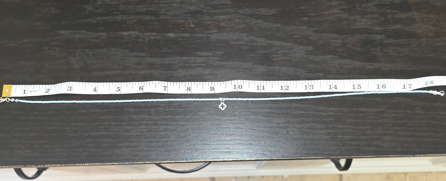 Beaded necklace with charm