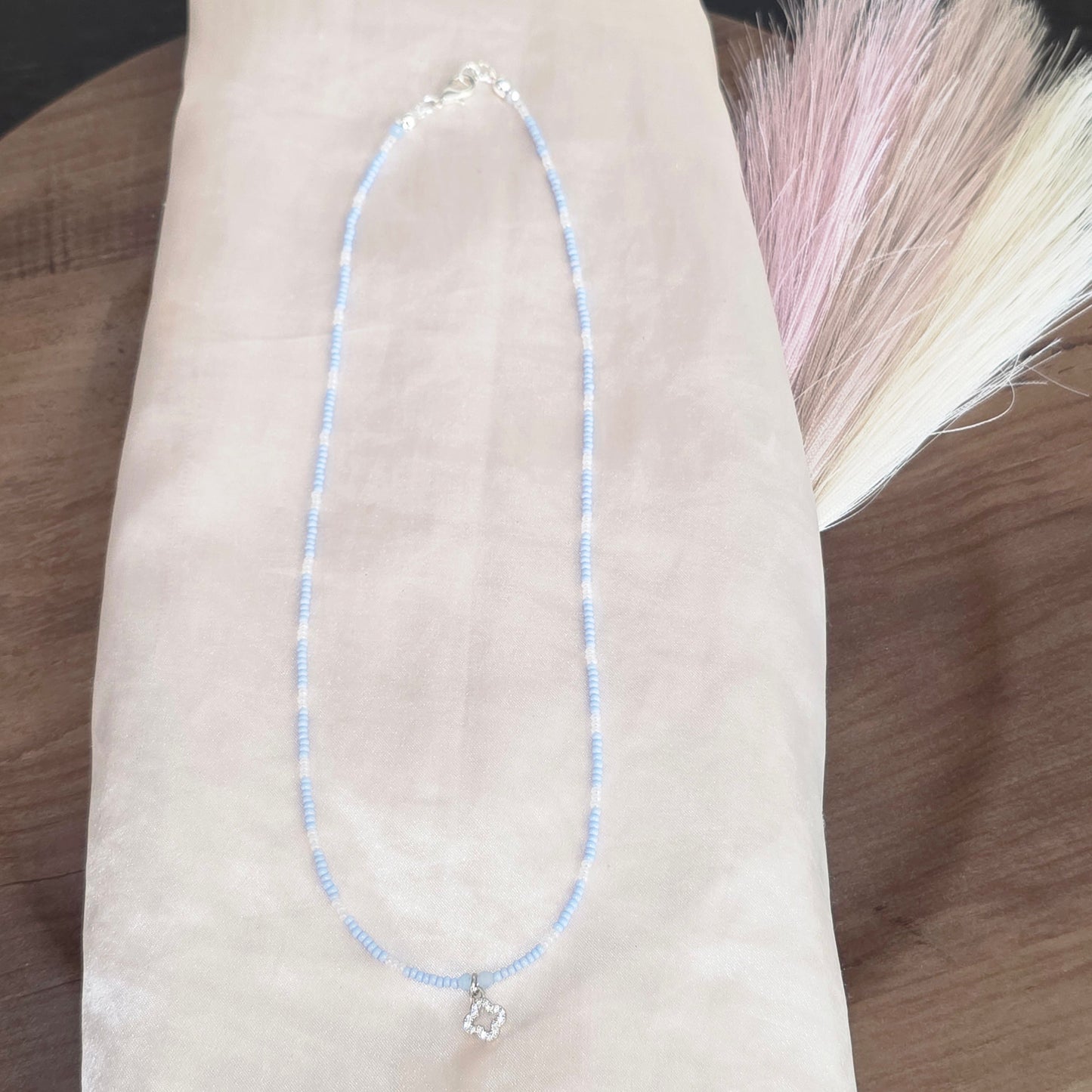 Beaded necklace with charm