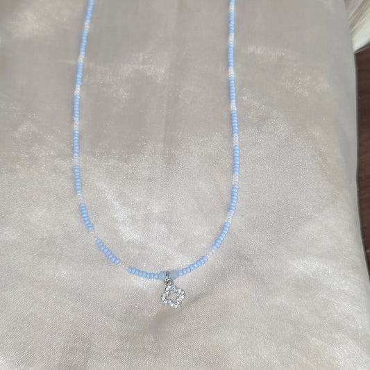 Beaded necklace with charm