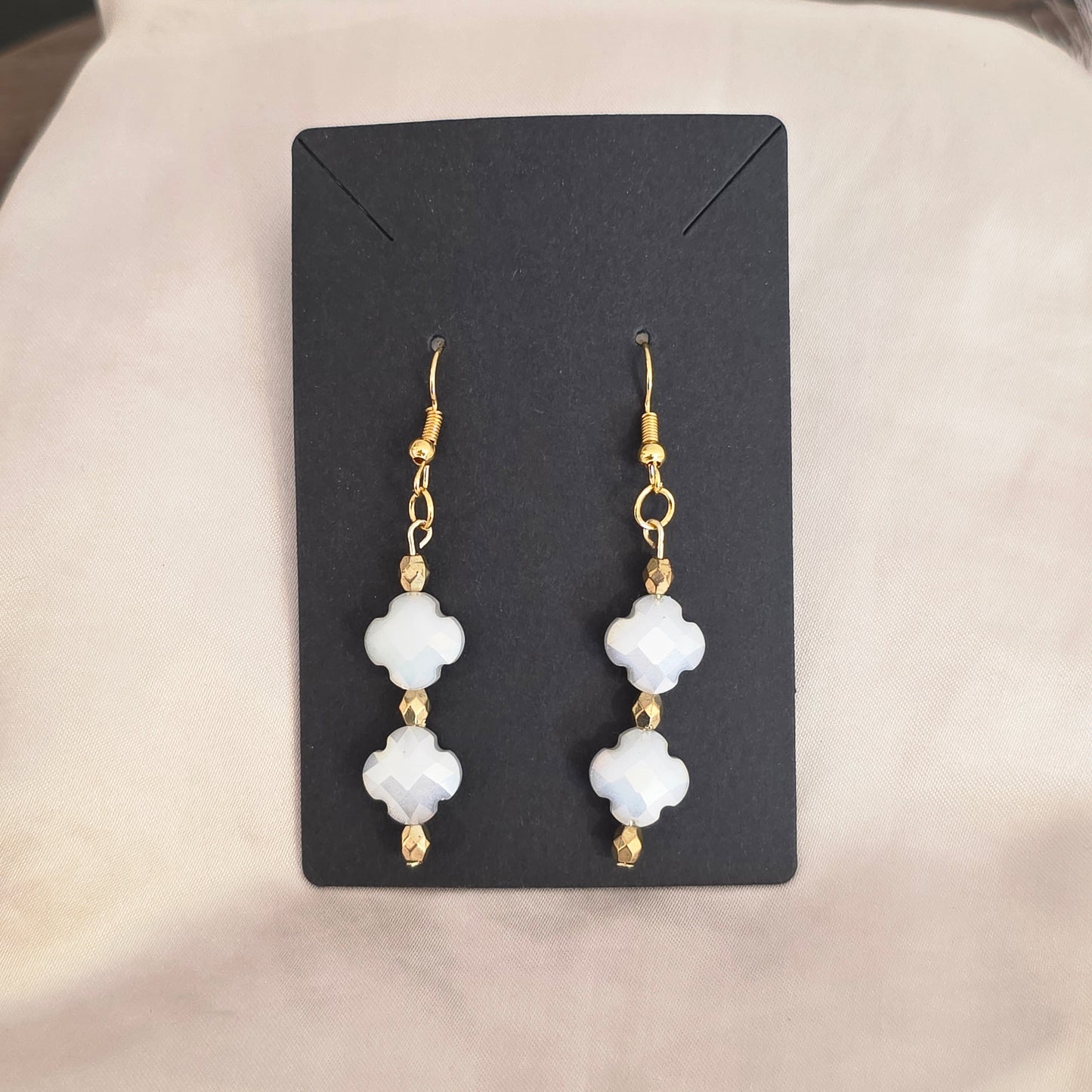 White and gold earrings