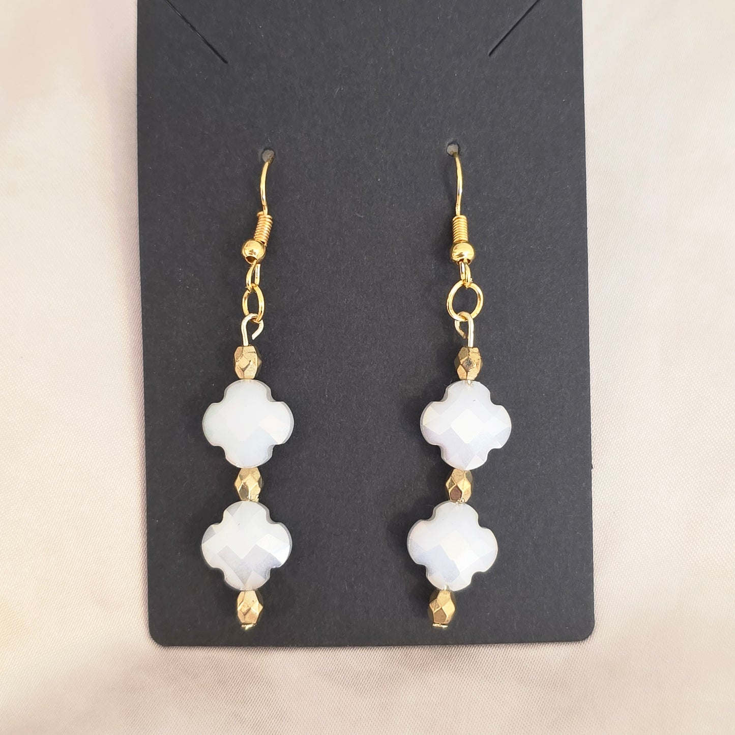 White and gold earrings