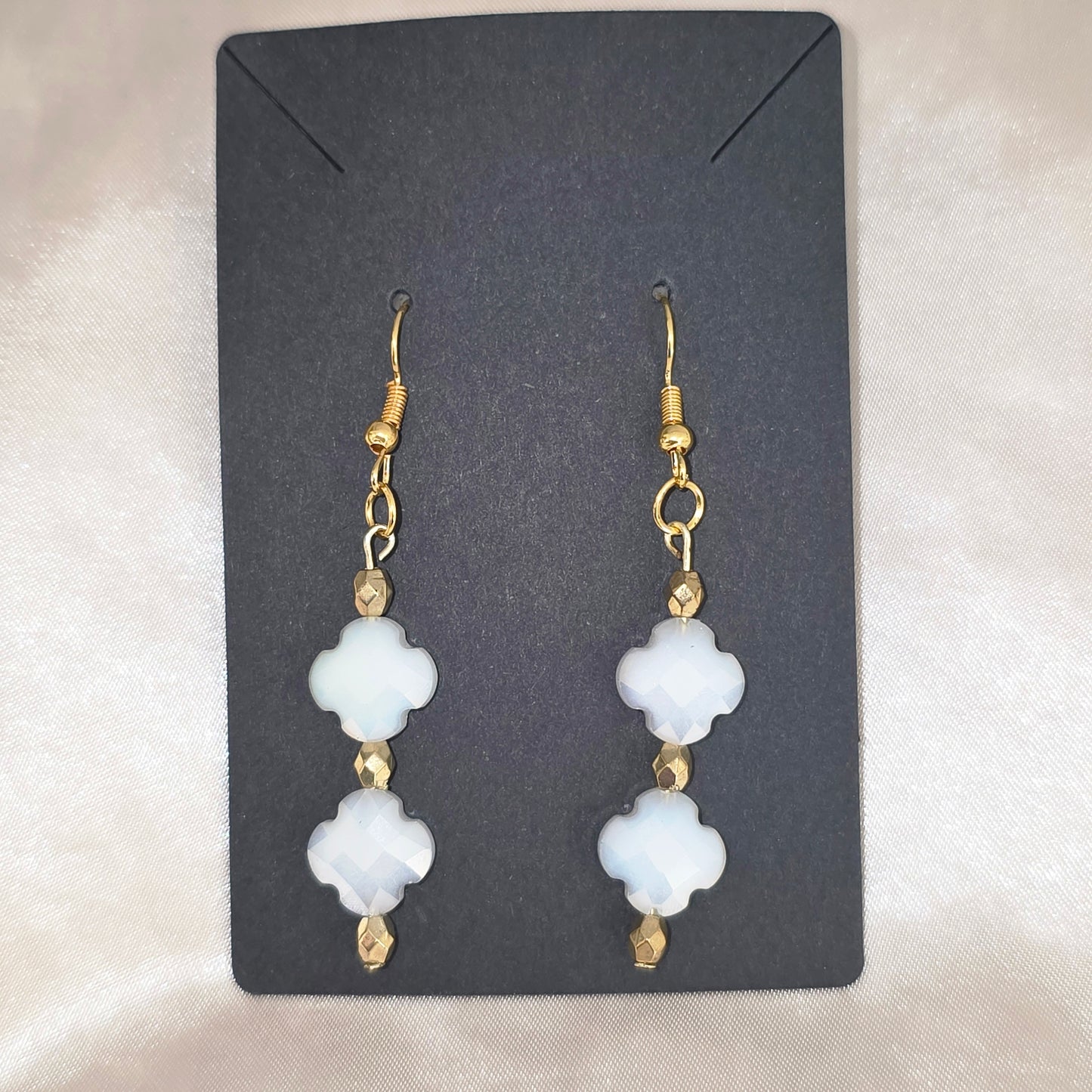 White and gold earrings